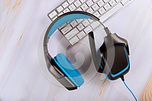 Headset lying on a computer keyboard of telemarketing, call center, client services or online support