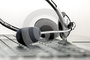 Headset lying on a laptop computer