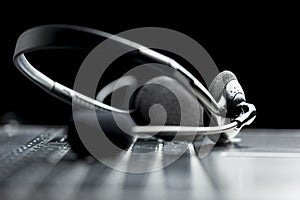 Headset lying on a laptop computer keyboardHeadset lying on a la