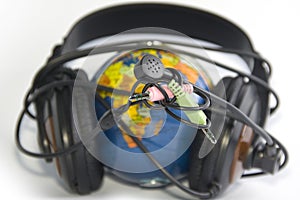 Headset on world globe isolated