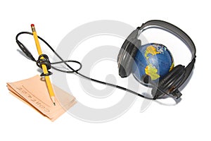 Headset on world globe with pencil and note isolat