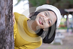 Headshort portrait smile young girl with big tree