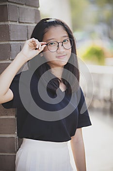 Headshot of asian teenager toothy smiling face with happiness emotion