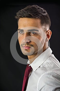 Headshot of attractive young man in studio