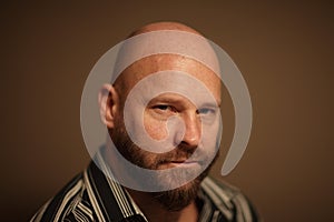 Headshot of a bald man