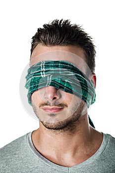 Headshot of blindfolded young man isolated on white
