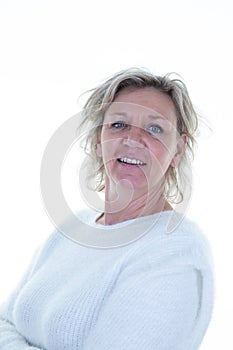 Headshot of blond senior woman while standing crossed arms folded at isolated white background