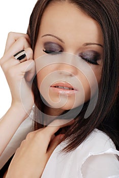 Headshot brunette woman with her eyes closed