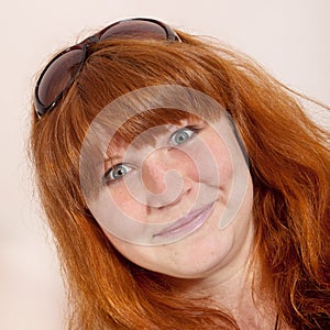 Headshot of cheerful redhead