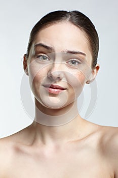 Headshot of emotional female face portrait with calm and tender facial expression