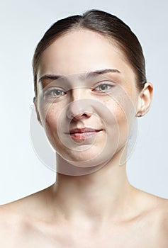 Headshot of emotional female face portrait with complacent facial expression