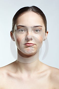 Headshot of emotional female face portrait with offended facial expression
