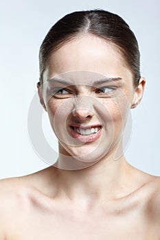 Headshot of emotional female face portrait with rage facial expression