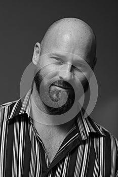 Headshot of a handsome bald man