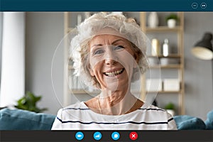 Headshot of happy senior woman talk on video call