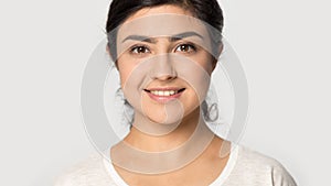 Headshot of indian girl look at camera posing in studio