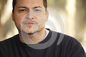 Headshot of a Latino man