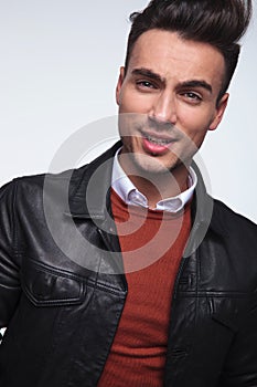 Headshot picture of a cool young fashion guy smiling