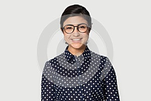 Headshot portrait beautiful Indian young woman in glasses photo