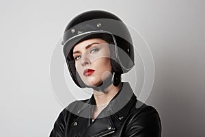 Headshot Portrait of fashion girl with red lips in black leather jacket smiling looking at camera over white background