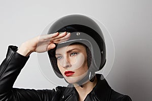 Headshot Portrait of girl with red lips in black leather jacket smiling looking at camera. White background