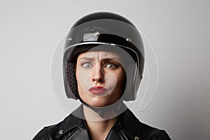 Headshot Portrait of girl with red lips in black leather jacket smiling looking at camera. White background