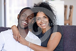 Headshot portrait of happy african millennial couple looking at camera