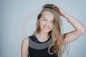 Headshot Portrait of happy girl with beauty face smiling looking at camera. Smiling student girl wearing casual dress.