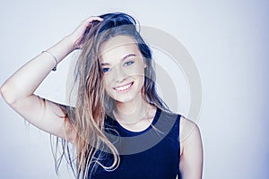 Headshot Portrait of happy girl with beauty face smiling looking at camera. Smiling student girl wearing casual dress.