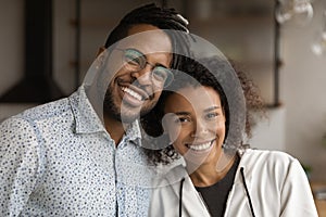 Headshot portrait of loving millennial black couple husband and wife