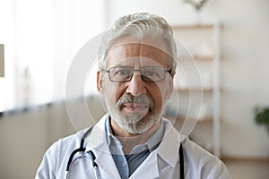 Headshot portrait of mature Caucasian male doctor in uniform