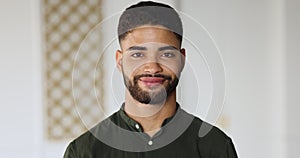 Headshot portrait Moroccan man in casual shirt looking at camera