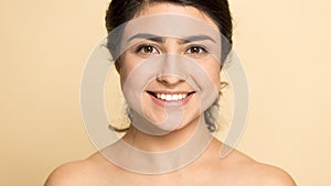 Headshot portrait of naked indian girl look at camera