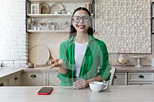 Headshot portrait screen view of smiling young woman sit at home talk on video call with friend or relative