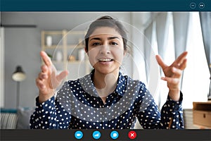 Headshot portrait of smiling indian woman talk on video call