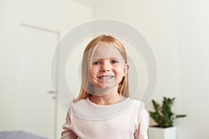 Headshot portrait of smiling little girl child