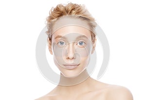 Young beautiful blond blue eyed woman with eye patches to remove eye puffiness photo