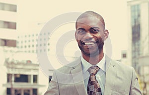 Headshot portrait of young man smiling photo