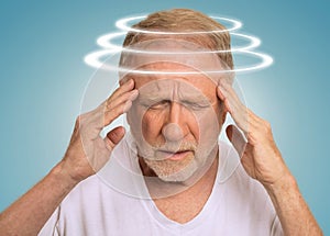 Headshot senior man with vertigo suffering from dizziness