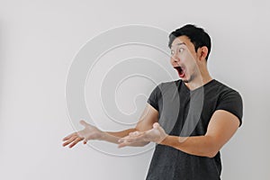 Headshot of shock face man in black t-shirt stand isolated on white.