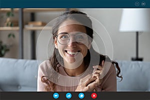 Headshot of smiling female talk on video call at home photo