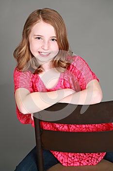 Headshot of smiling girl with freckles