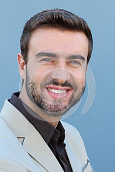 Headshot smiling modern man, creative professional isolated on blue wall background