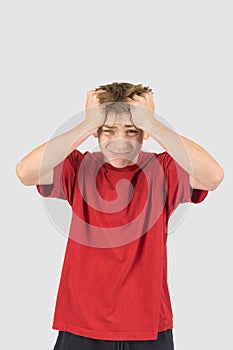 Headshot of a stressed teenage boy