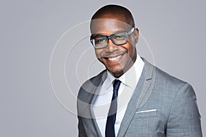 Headshot of successful smiling cheerful african american businessman executive stylish company leader photo