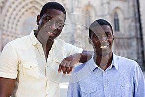 Headshot of two positive African Americans outdoors