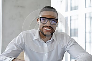 Headshot webcam portrait successful African businessman make video call