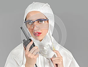 Headshot of woman in white protective suit of