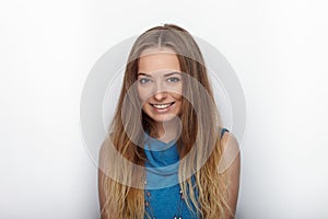 Headshot of young adorable blonde woman with cute smile on white background