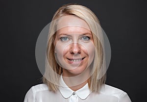 Headshot of young and happy business woman